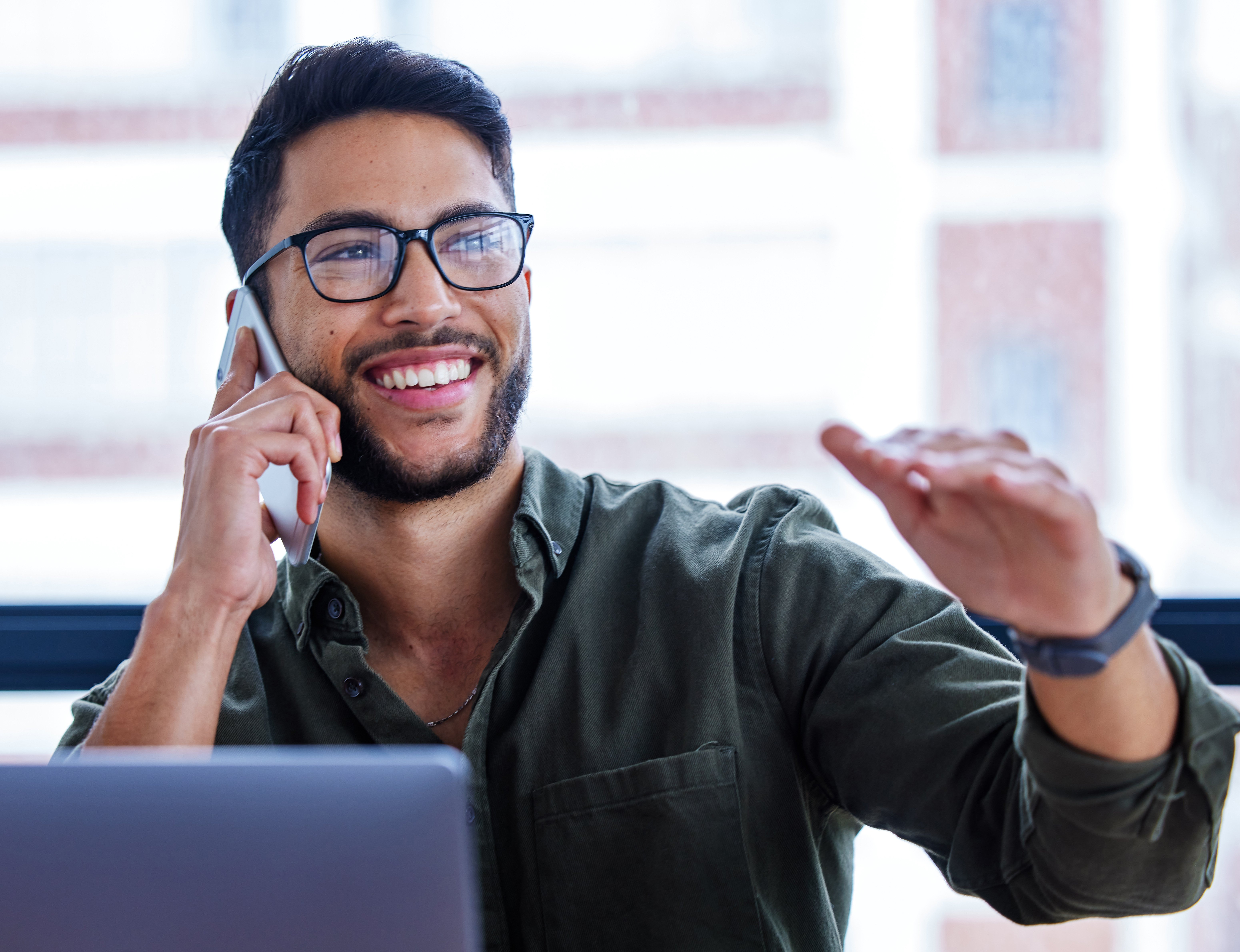 shot-of-a-young-businessman-talking-on-a-cellphone-2025-04-06-11-56-17-utc
